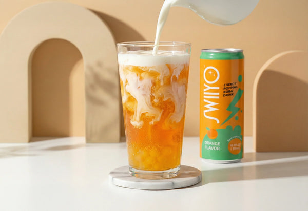 Swiiyo Dirty Energy Drink with orange energy popping boba and a cream swirl